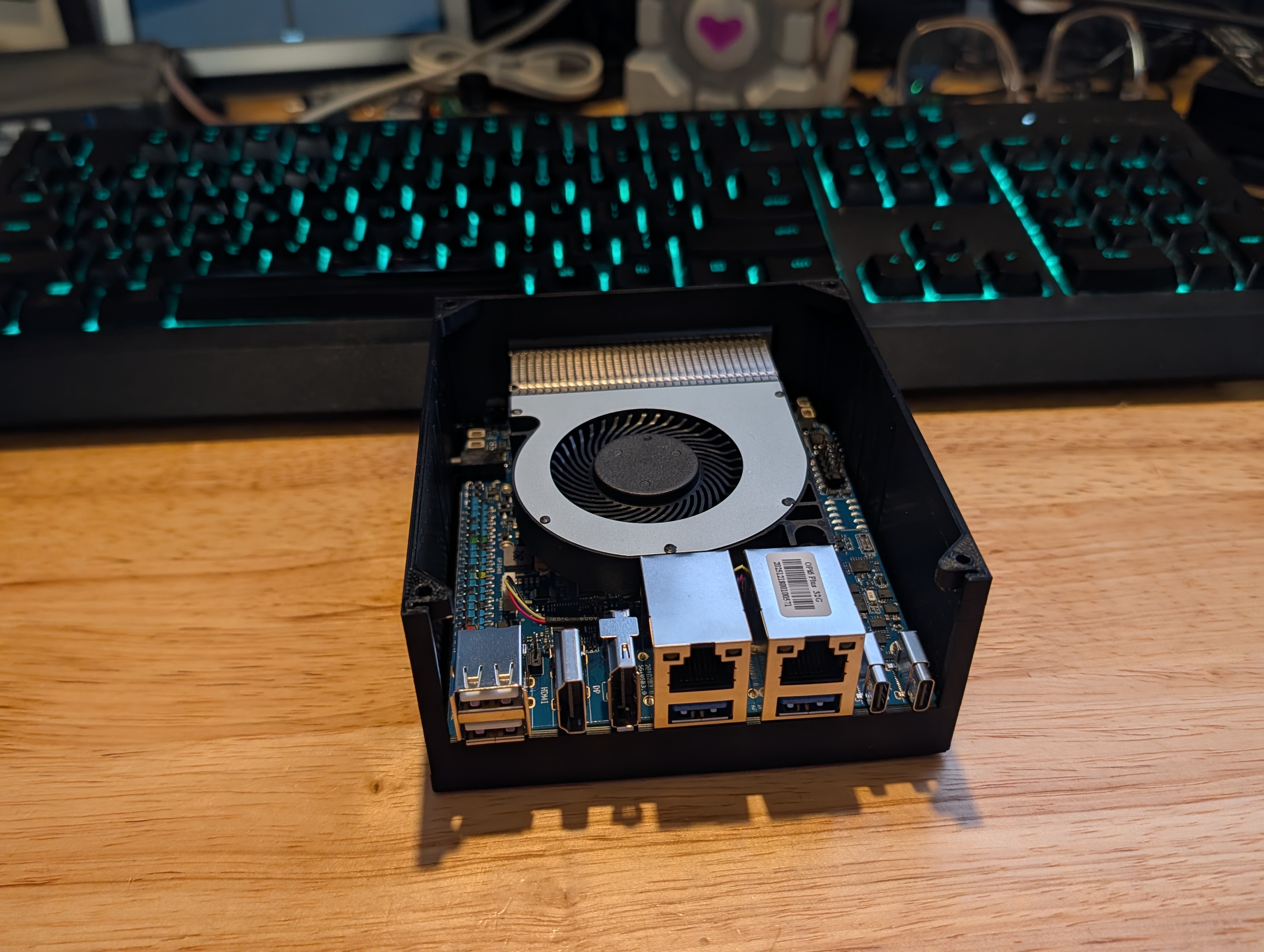 A compact single-board computer in a black case